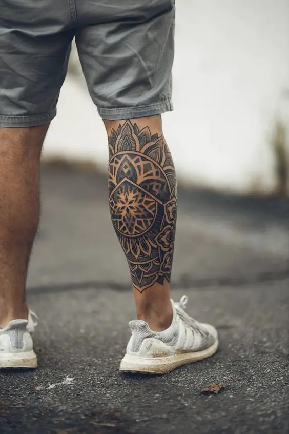 A leg tattoo with sflower shapes