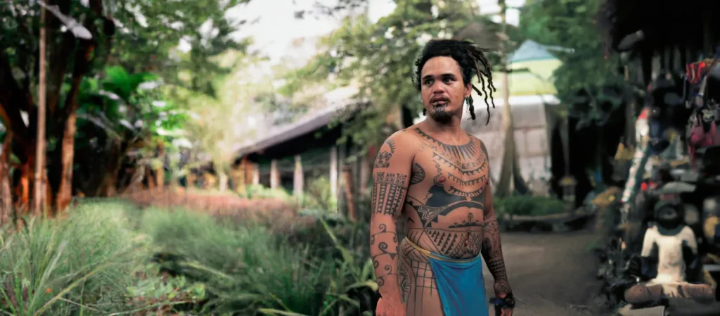 A traditional man with tribal tattoos on his body