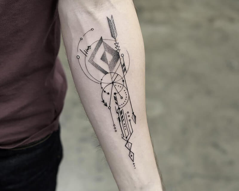 A geometric tattoos for men, on the forearm, featuring intersecting lines and shapes forming an intricate geometric pattern.